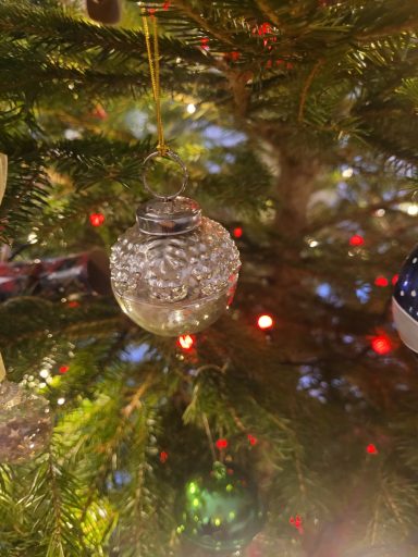 a silver baubles on a Christmas tree