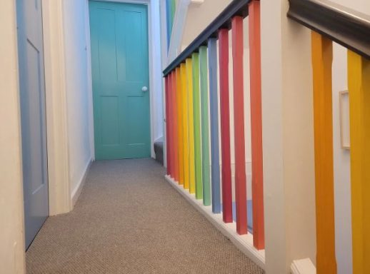 A set of rainbow painted bannisters